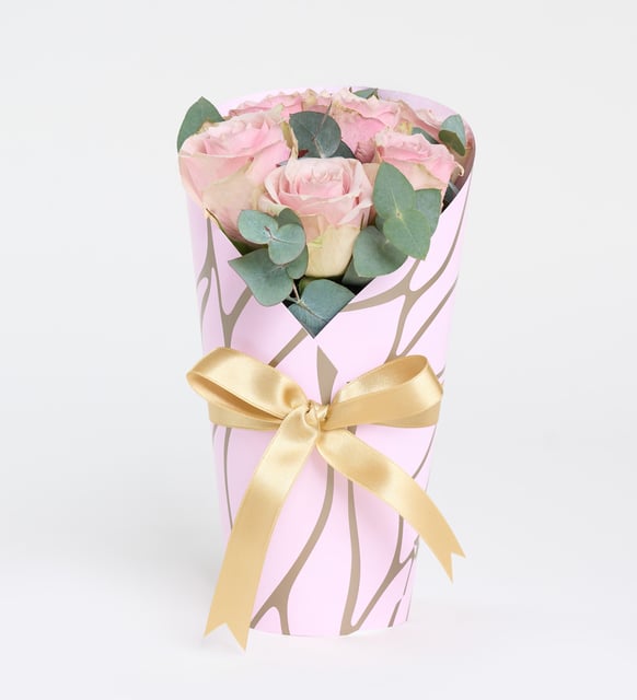 7 pink roses in a pink decorative box