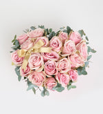 Pink rose with a yellow ribbon in a pink heart box