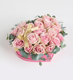 Pink rose with a yellow ribbon in a pink heart box