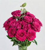 32 mini pink roses in glass vase