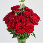 32 mini pink roses in glass vase