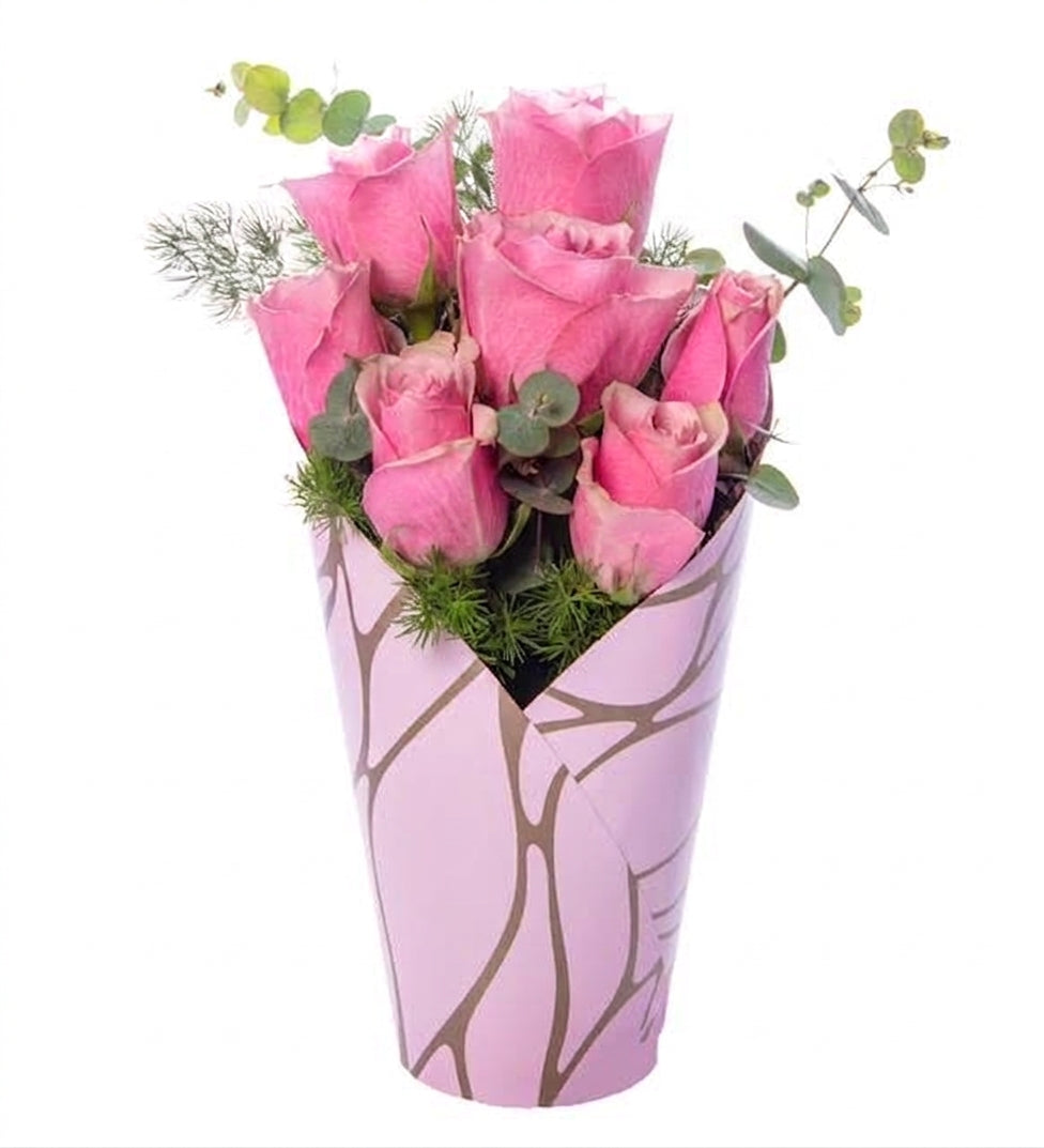 7 pink roses in a pink decorative box