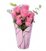 7 pink roses in a pink decorative box