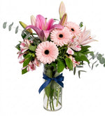 Alstroemerias, lilies, and white gerbera daisies in a vase