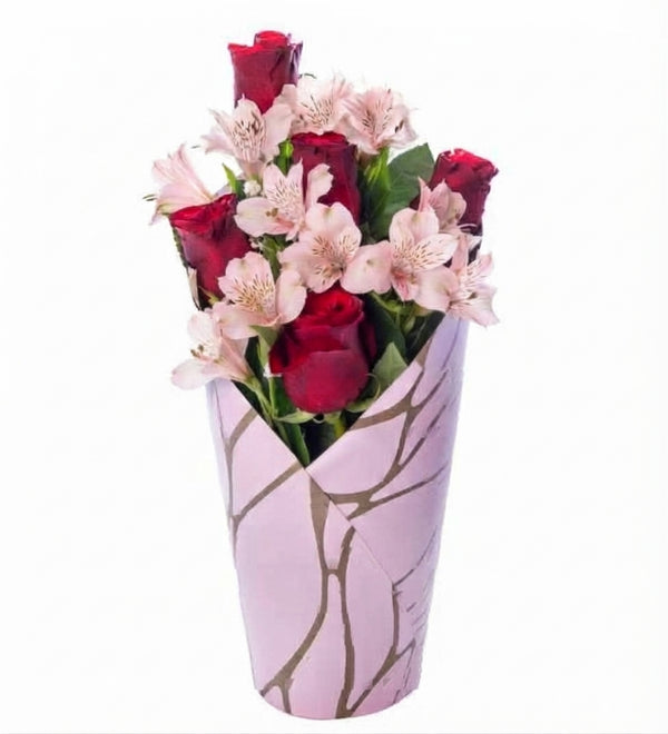 Red roses and white alstroemeria in a pink decorative box