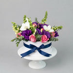 Verona - Caja de Rosas Claritas con Lisianthus y Orquídea LolaFlora