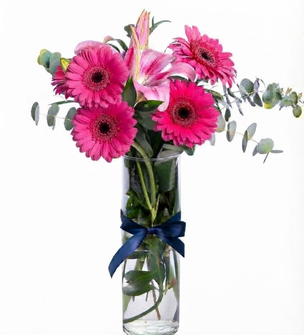 Pink lilies and colorful gerberas in the vase
