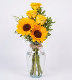 Yellow roses and sunflowers in a vase