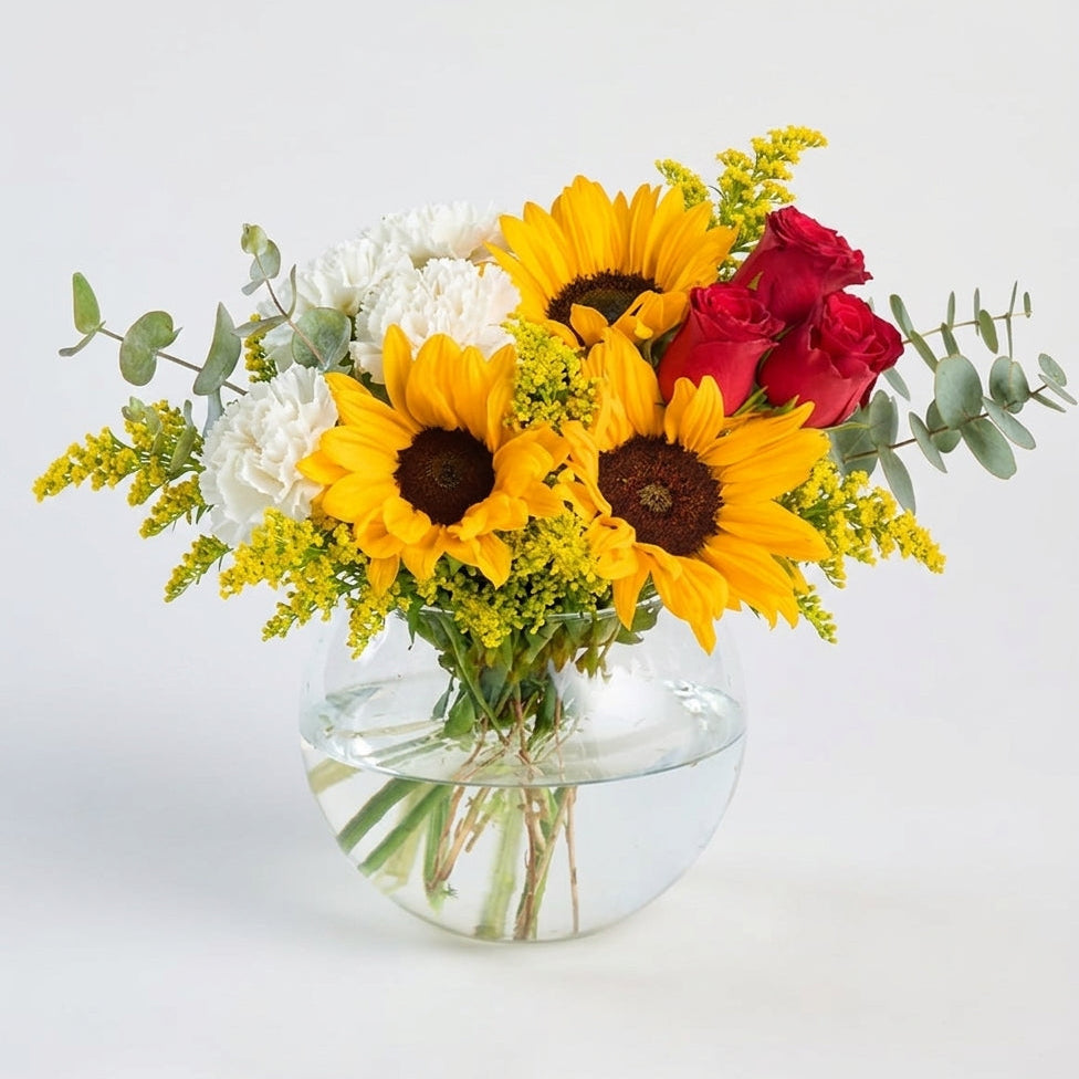 Sunflower and red rose and white daisy in a fishbowl vase