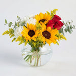 Sunflower and red rose and white daisy in a fishbowl vase