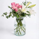 Pink roses and white lily in a vase