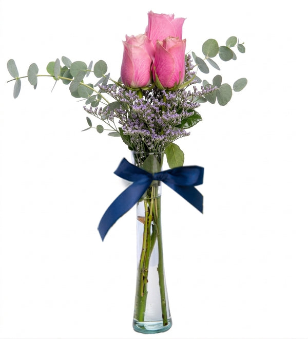 3 pink roses in a cylindrical vase