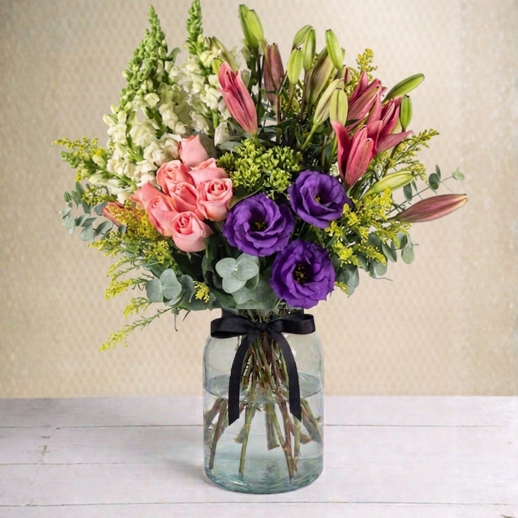 Pink Roses, Lily, and Purple Accents Arrangement