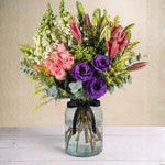 Pink Roses, Lily, and Purple Accents Arrangement